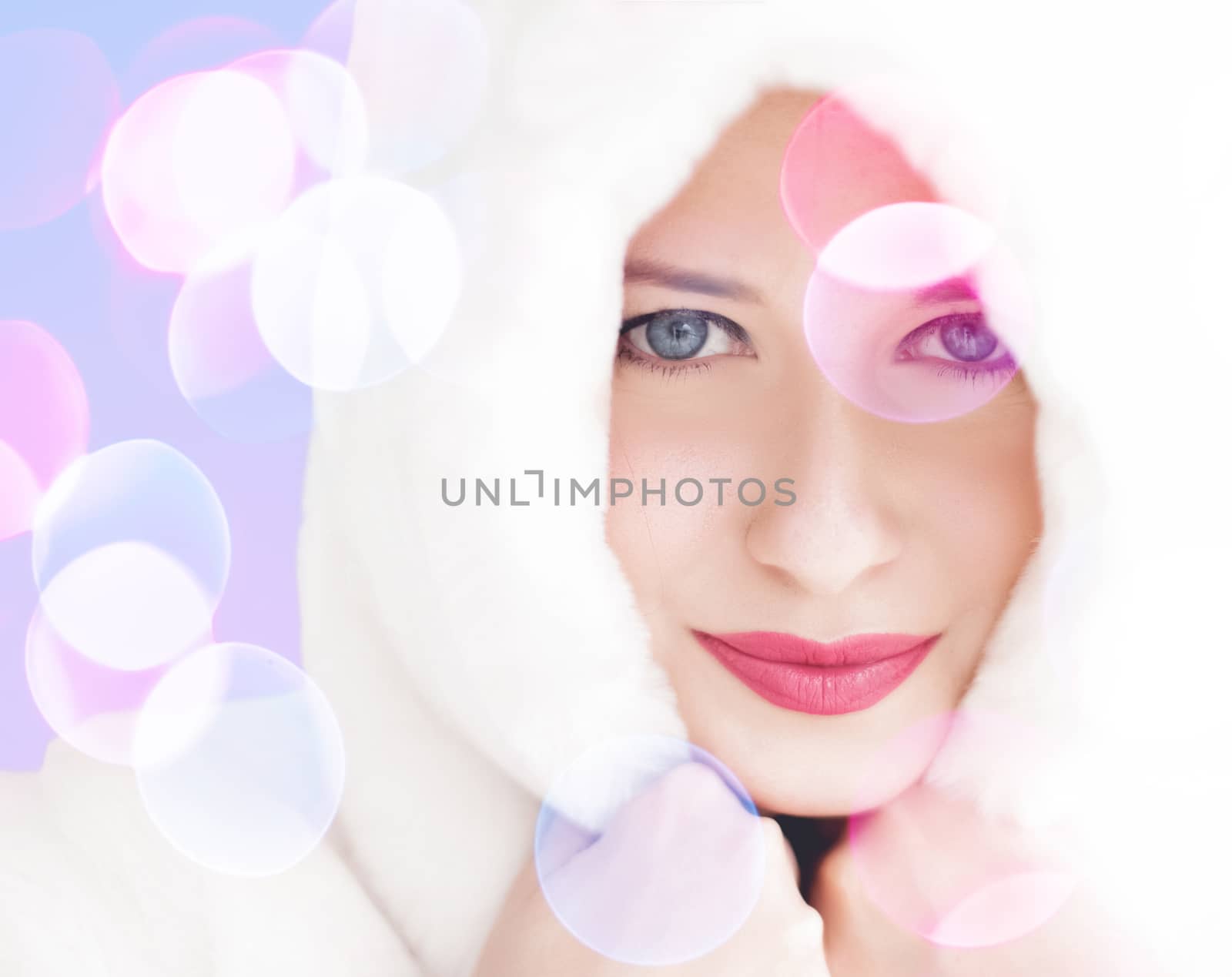 Merry Christmas portrait of smiling young woman wearing fluffy white fur coat, luxury beauty and happy holidays