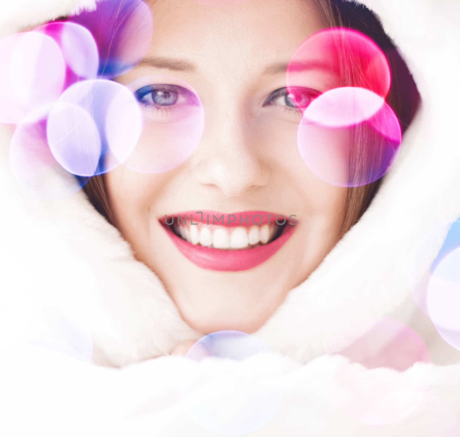 Merry Christmas portrait of smiling young woman wearing fluffy white fur coat, luxury beauty and happy holidays