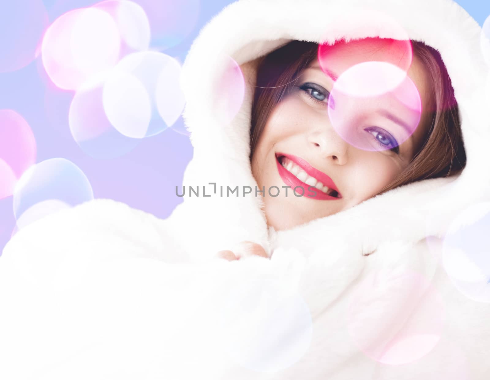 Merry Christmas portrait of smiling young woman wearing fluffy w by Anneleven