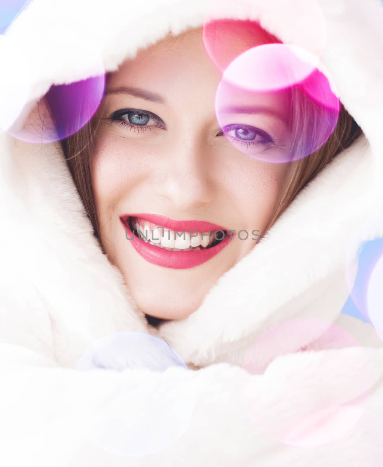 Merry Christmas portrait of smiling young woman wearing fluffy white fur coat, luxury beauty and happy holidays