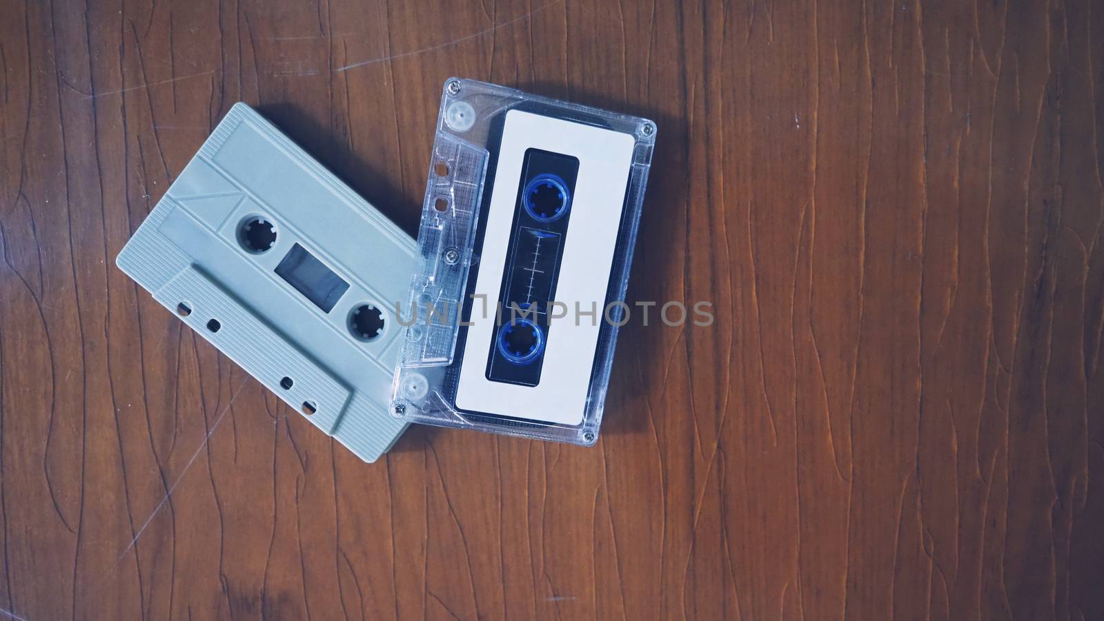 Close-up images of cassette tape on retro wood table. represent  by gnepphoto