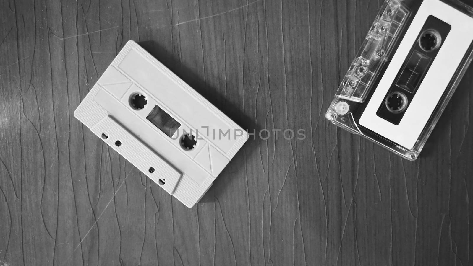 Close-up images of cassette tape on retro wood table. represent  by gnepphoto
