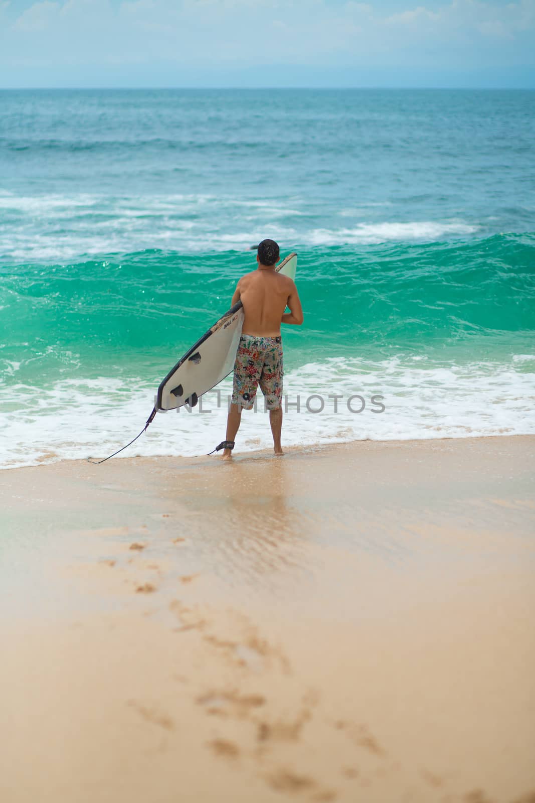 Surfer. Surfing Man With Surfboard Walking On Sandy tropical Beach. Healthy Lifestyle, water activities, Water Sport. Beautiful Ocean