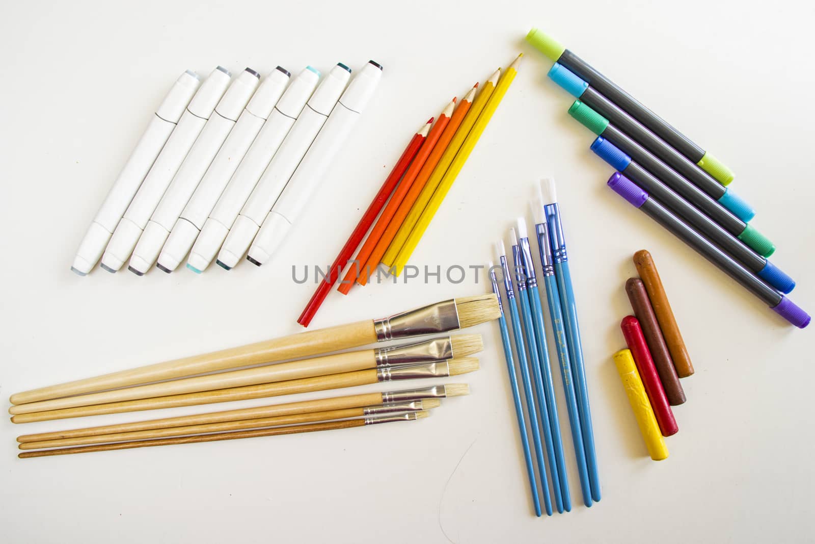 large group of drawing attributes, large group of pencil, pen and markers, sketching markets. Stationary things for painting by Taidundua