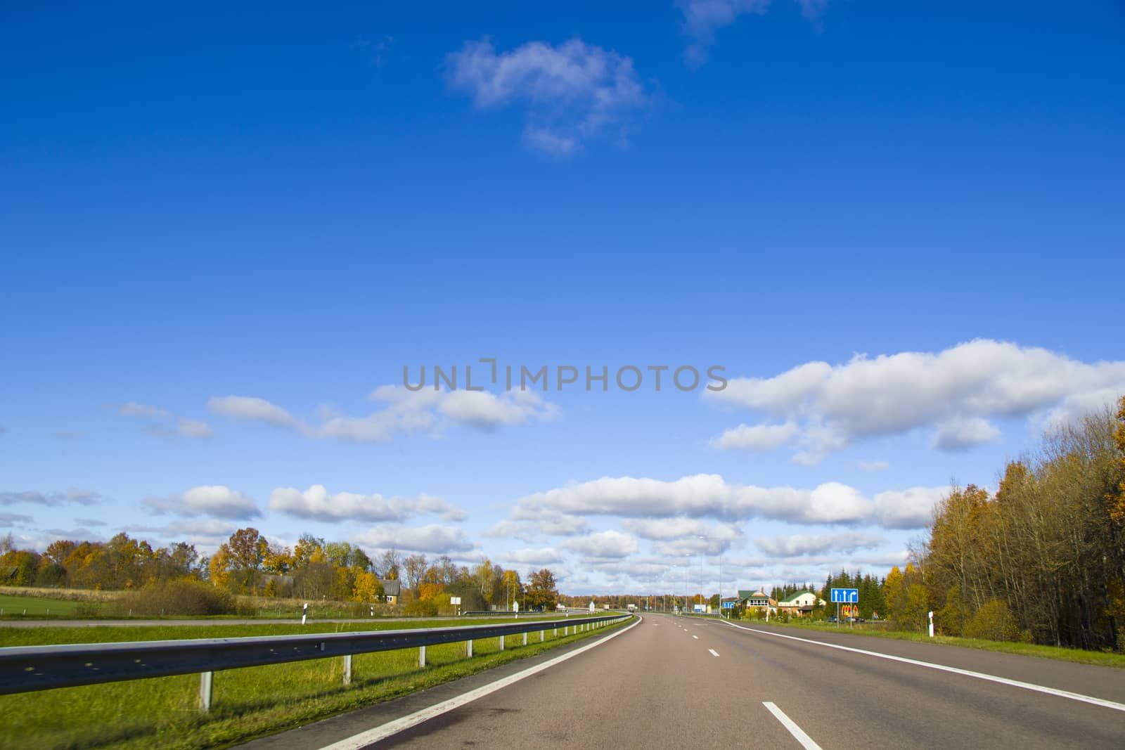 Highway, autobahn and road landscape. Automobile, cars and vehicles. Blue sky and sunny day. European autobahn. Nature and urban together.