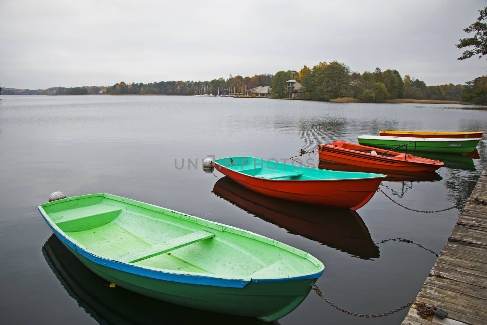 Old wooden boats near the beach of Trakai Gavle lake l, Lithuania by Taidundua