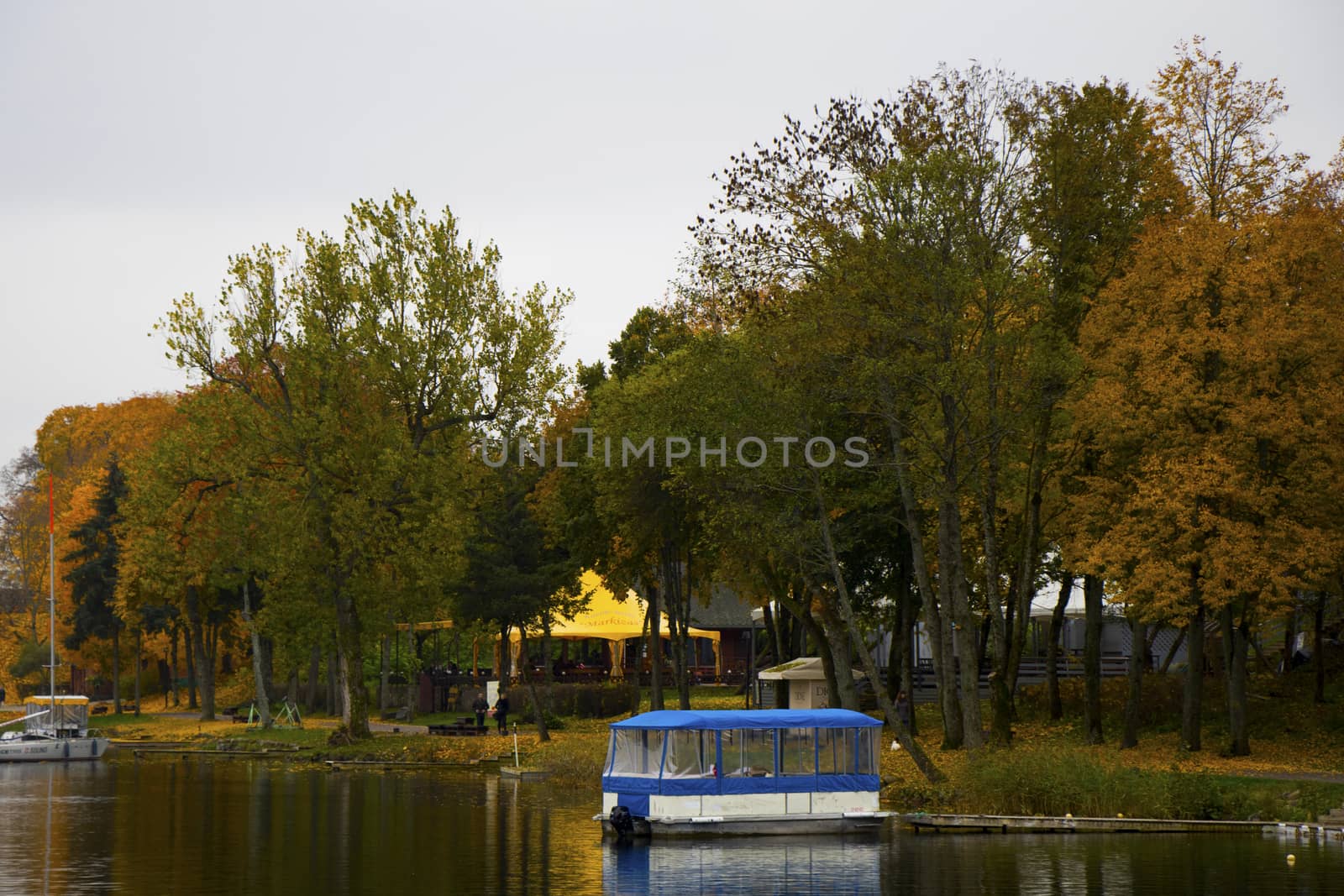 Old wooden boats near the beach of Trakai Gavle lake , Lithuania. Autumn and fall time.