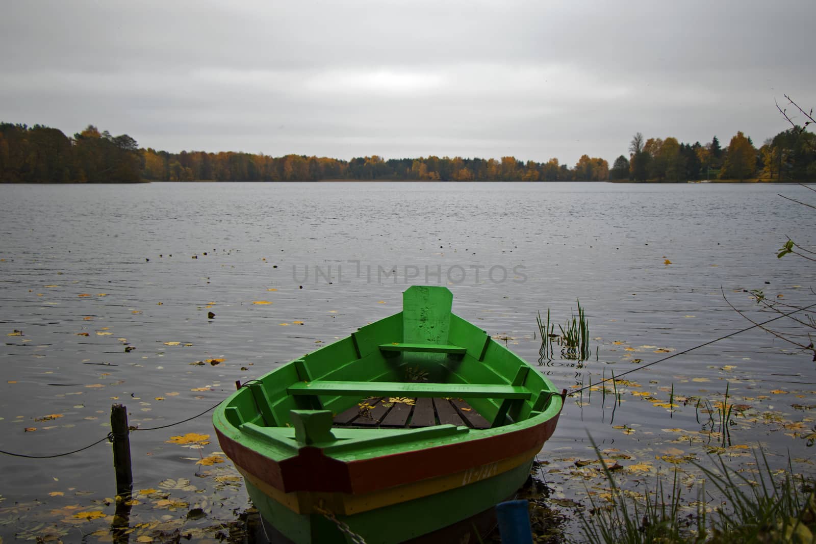 Old wooden boats near the beach of Trakai Gavle lake lake, Lithuania. Autumn and fall time.