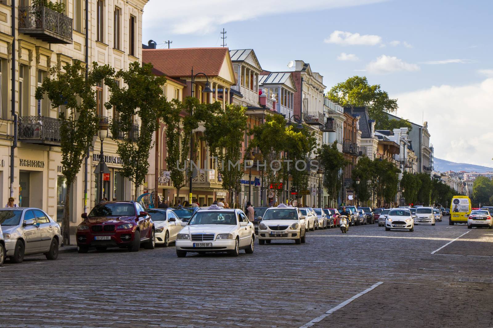 Tbilisi city center, street situation, people, cars and buildings. by Taidundua