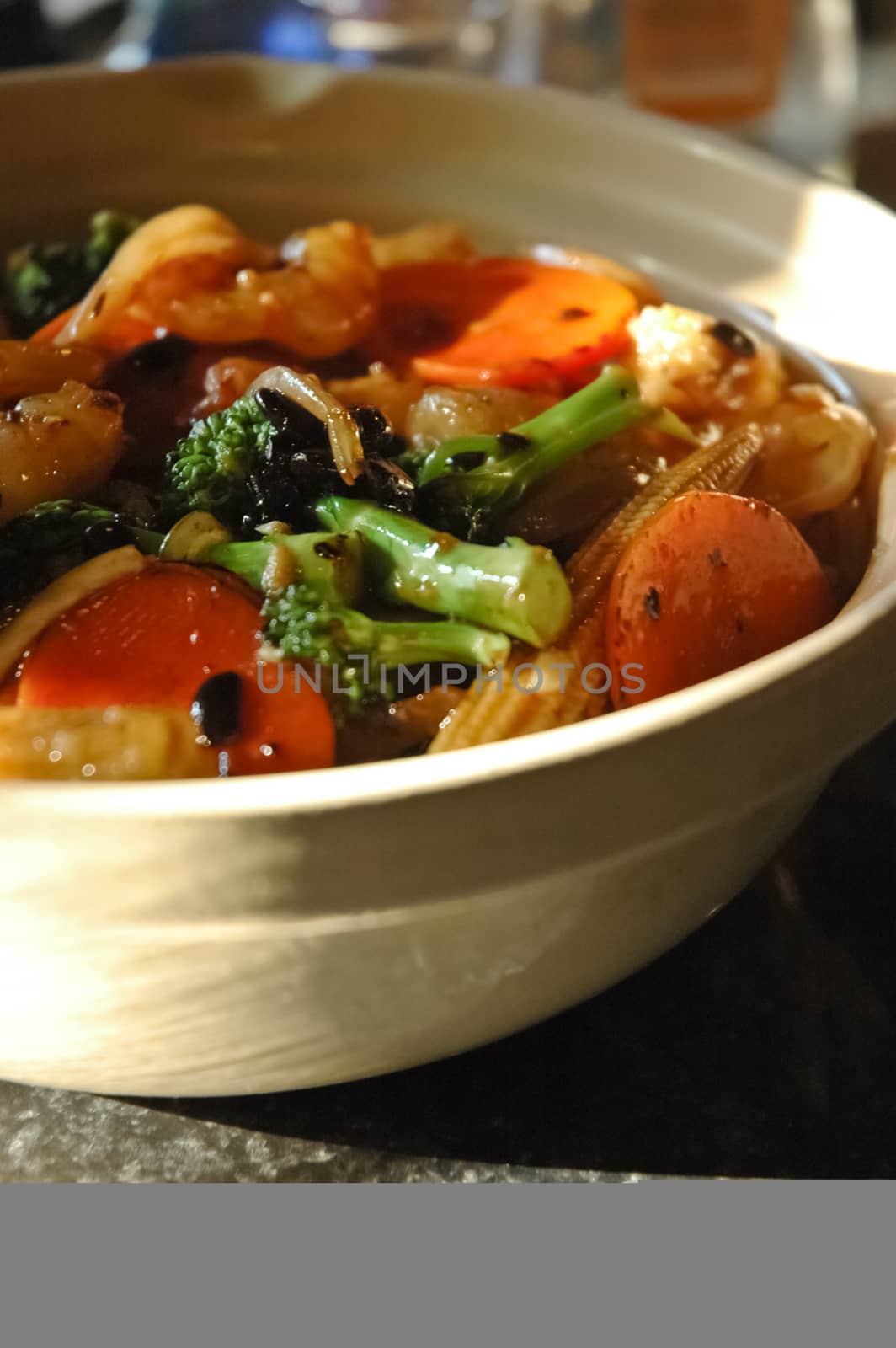 Chinese vegetable stir-fried in hot pot on rice with black bean sauce