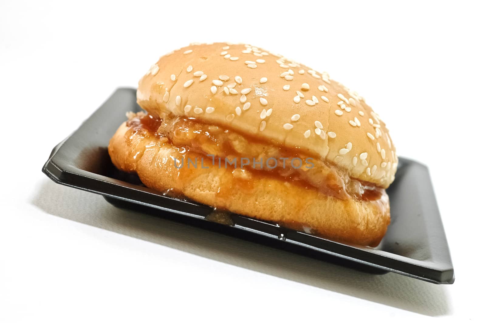 Meat beef hamburger isolated on black plate with white background