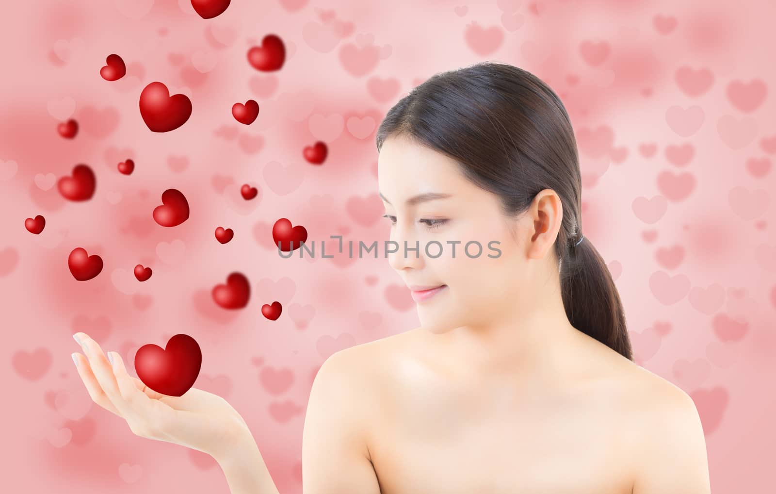 Beauty asian woman blowing mouth valentines heart with perfect make up, Girl showing love. Gestures for advertising cosmetic on yellow background.