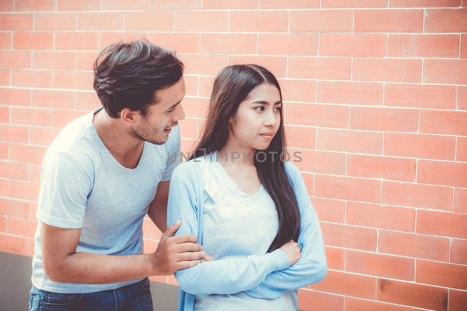 Portrait of couple asian young woman and man outdoor with relationship problem together, emotion unhappy concept.