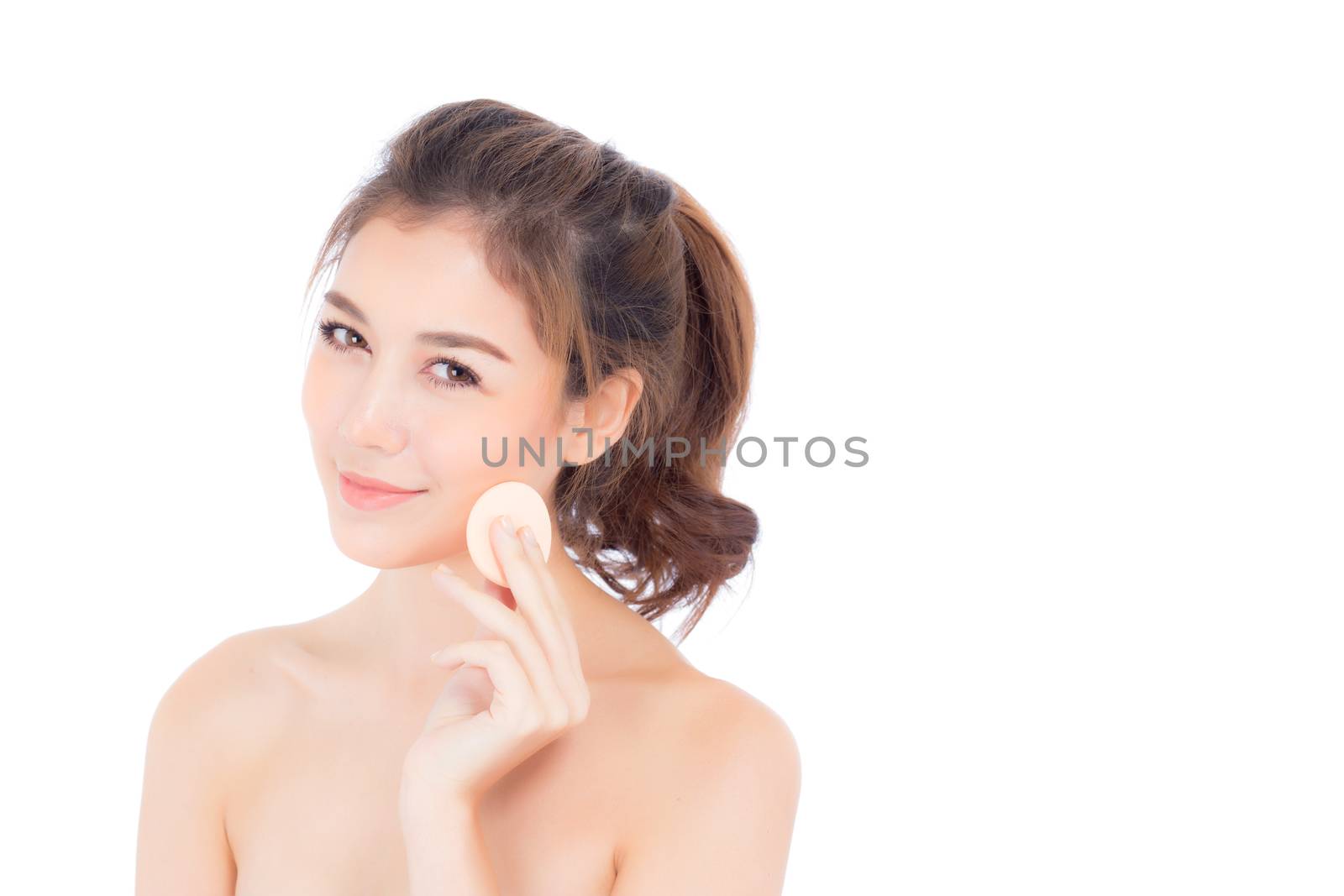Portrait of beautiful asian woman applying powder puff at cheek makeup of cosmetic, beauty of girl with face smile isolated on white background, wellness and healthcare concept.