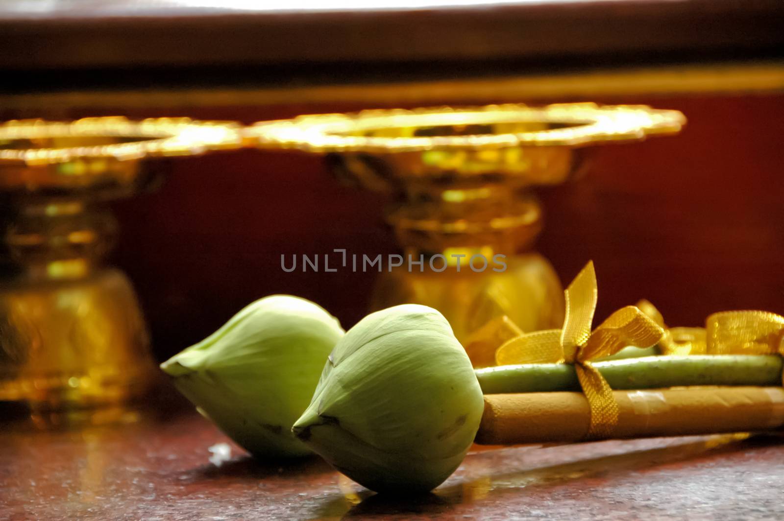 lotus and candle offering in Thai temple by eyeofpaul