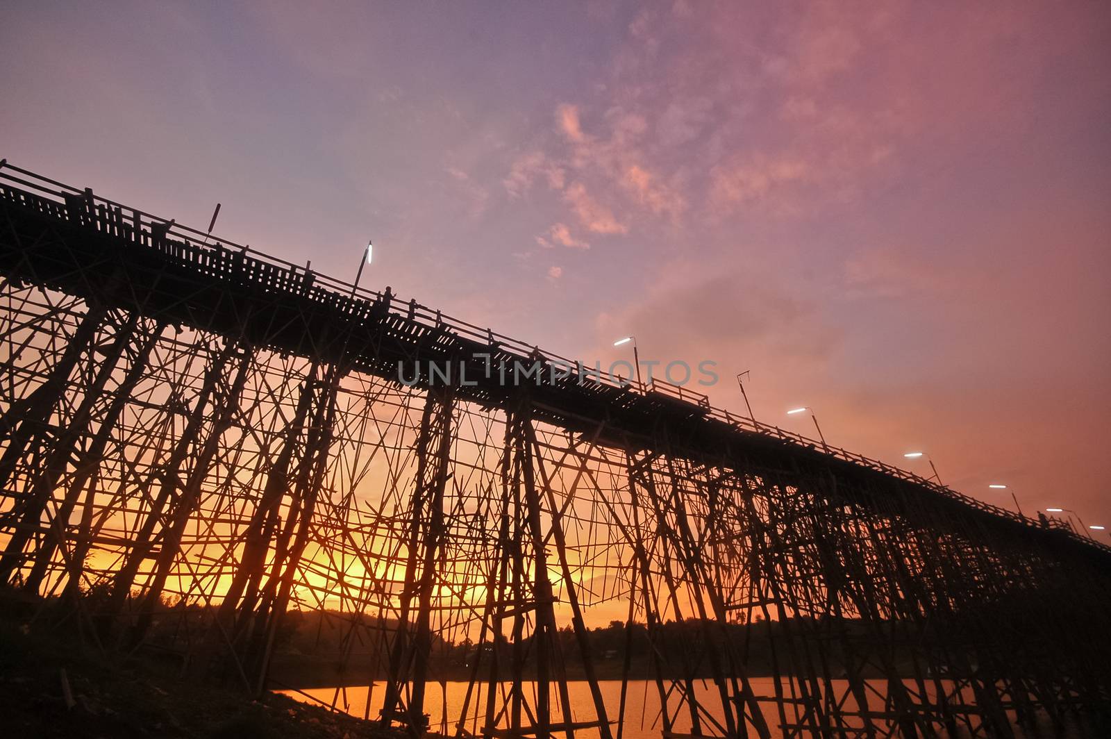 Silhouette scene of the twilight great bamboo bridge in Sangkhlaburi Western Thailand