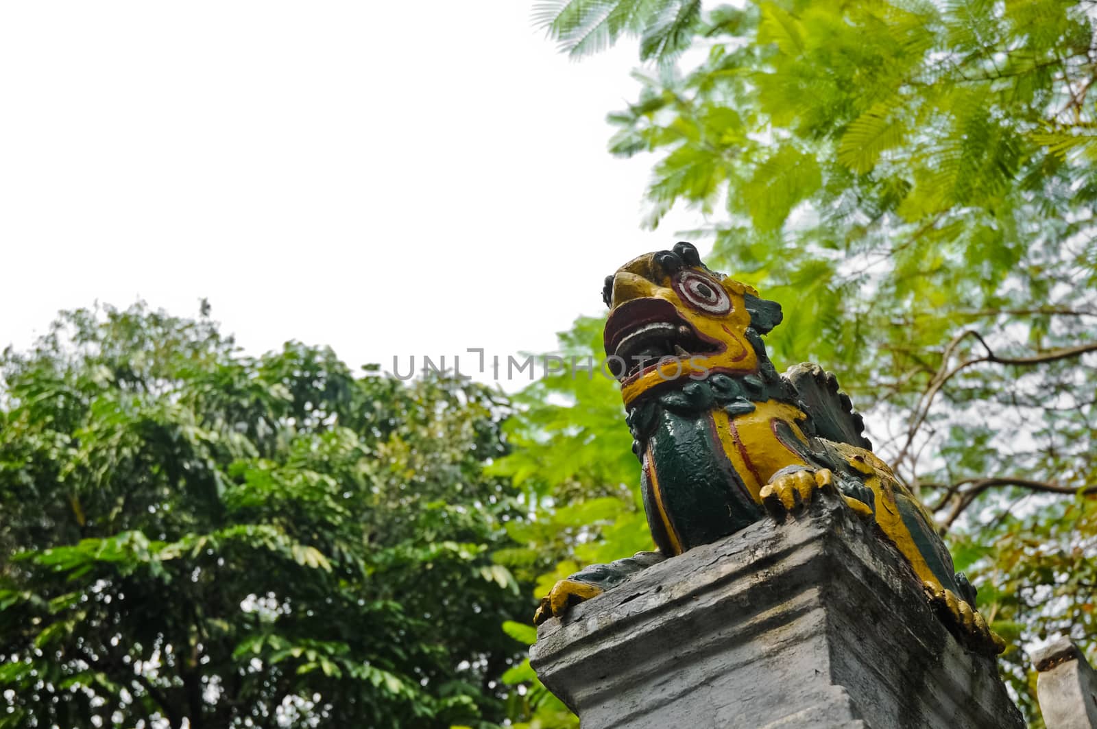 Vietnamese dragon sculpture on an old pillar in Hanoi