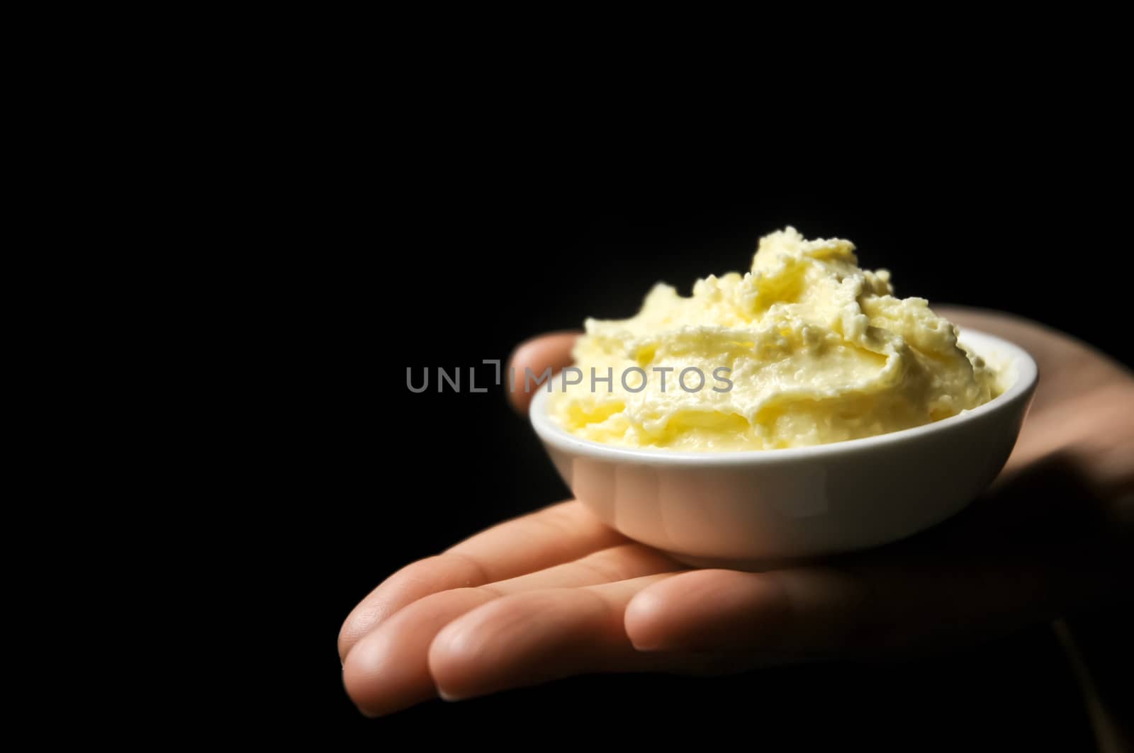 Isolated mashed potato on a hand by eyeofpaul