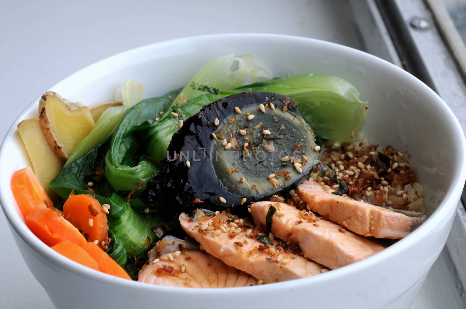 Japanese salmon with mixed salad on rice