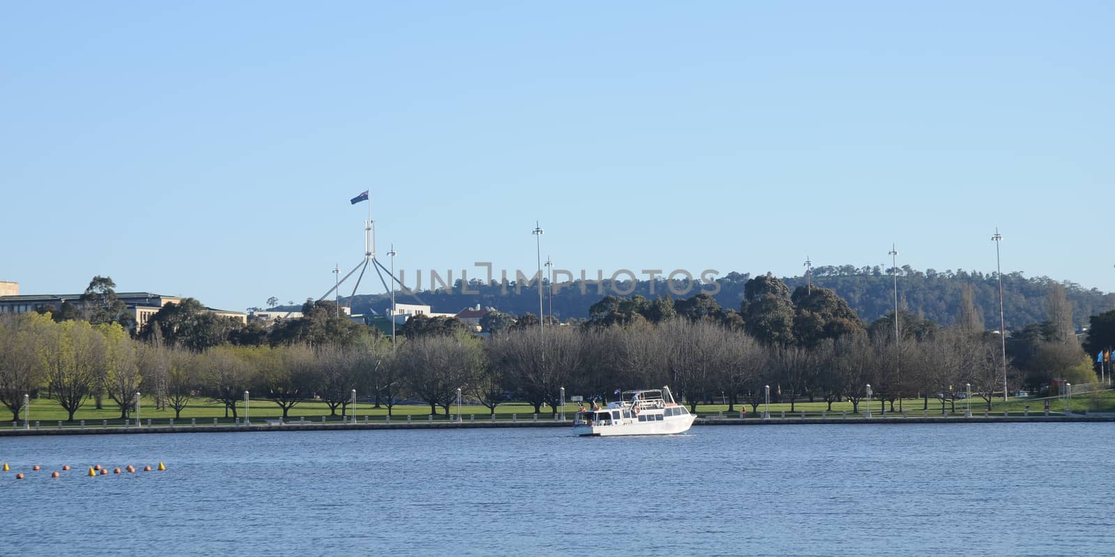 City lake and Australia parliament in Canberra by eyeofpaul