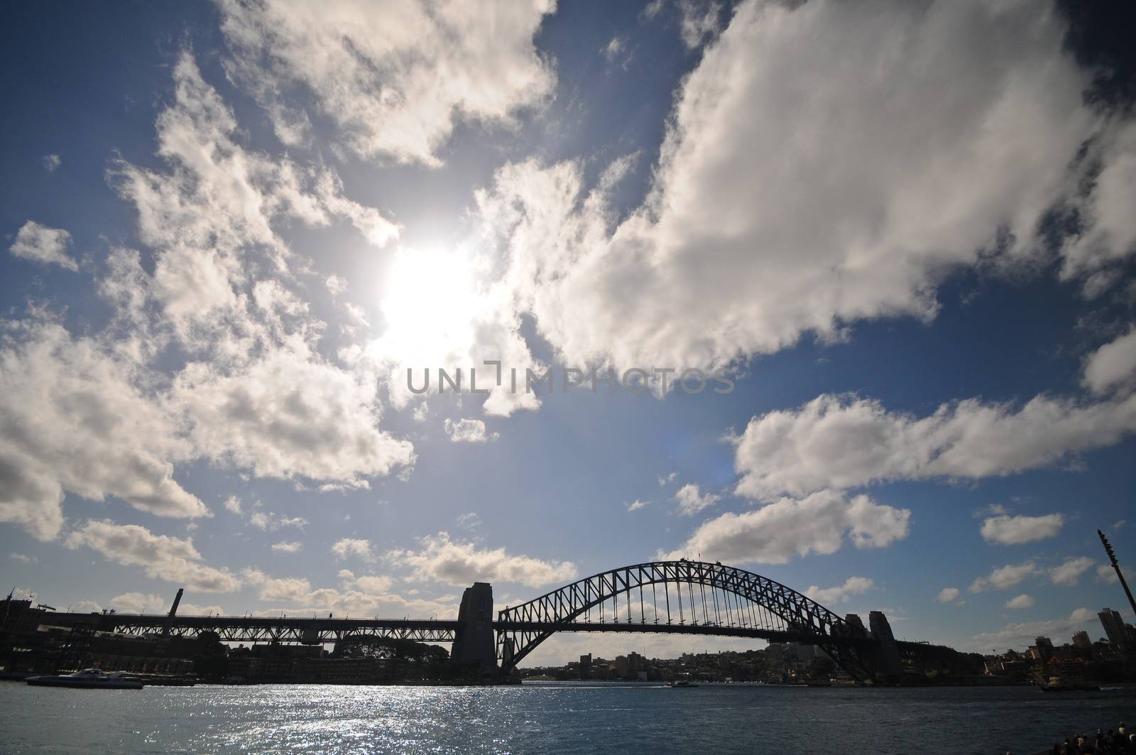 Sydney Harbour Bridge in sunny day and cloudscape by eyeofpaul