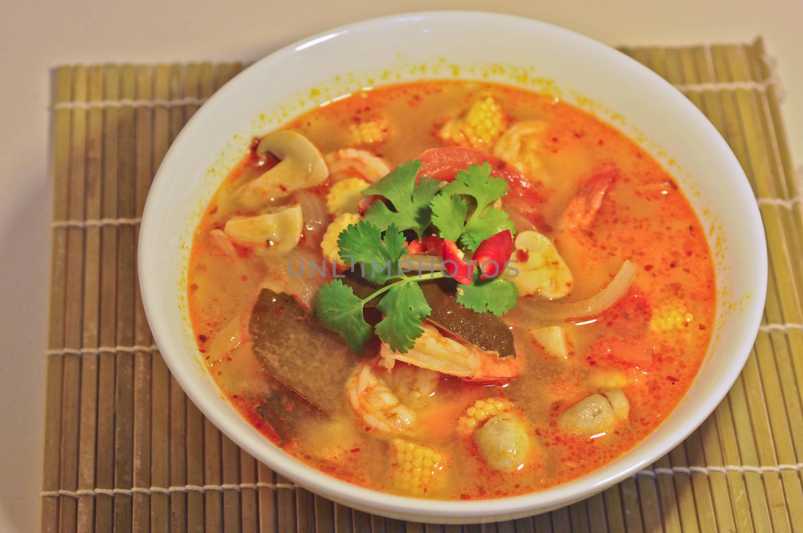 Tom Yum Kung - Hot Spicy Sour Thai herbal soup with prawn by eyeofpaul