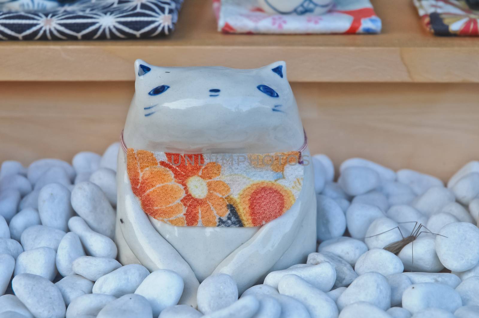 Cute Japanese ceramic cat doll with orange flower cloth