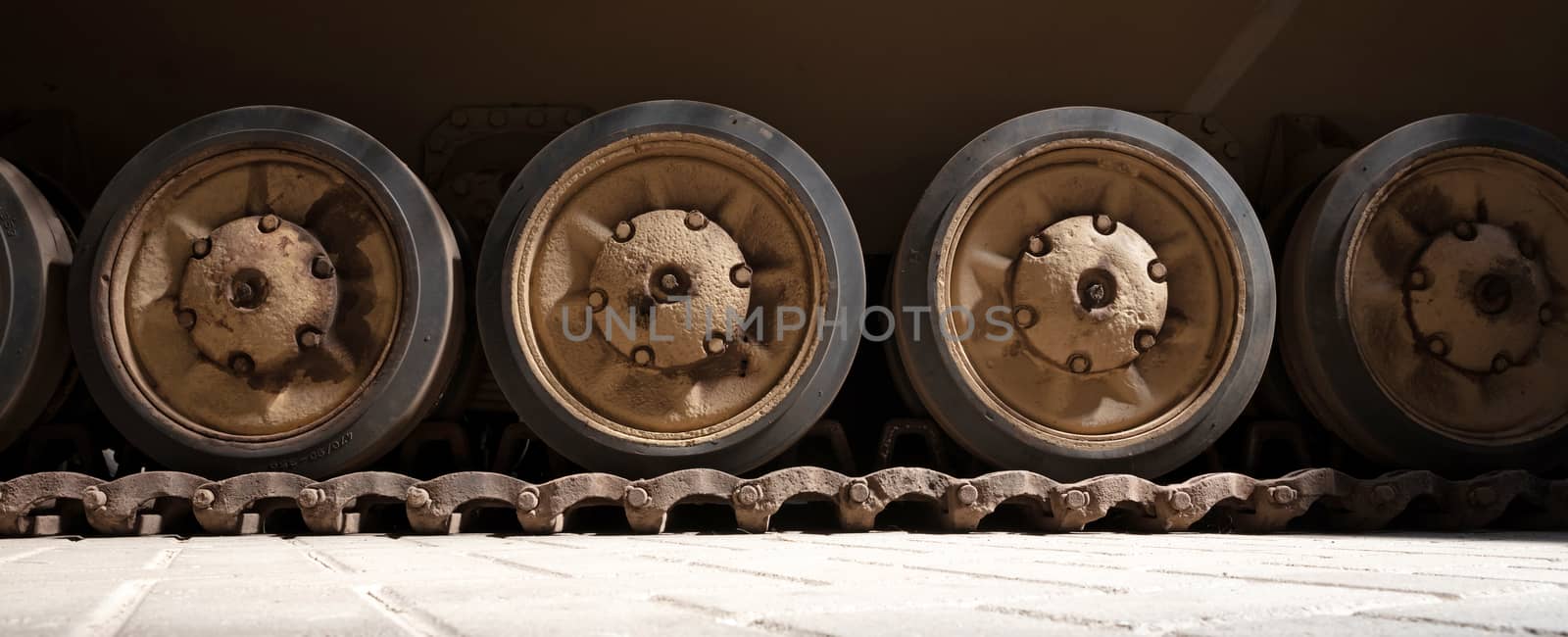 Tracks and wheels of tank, armored vehicle, old tank