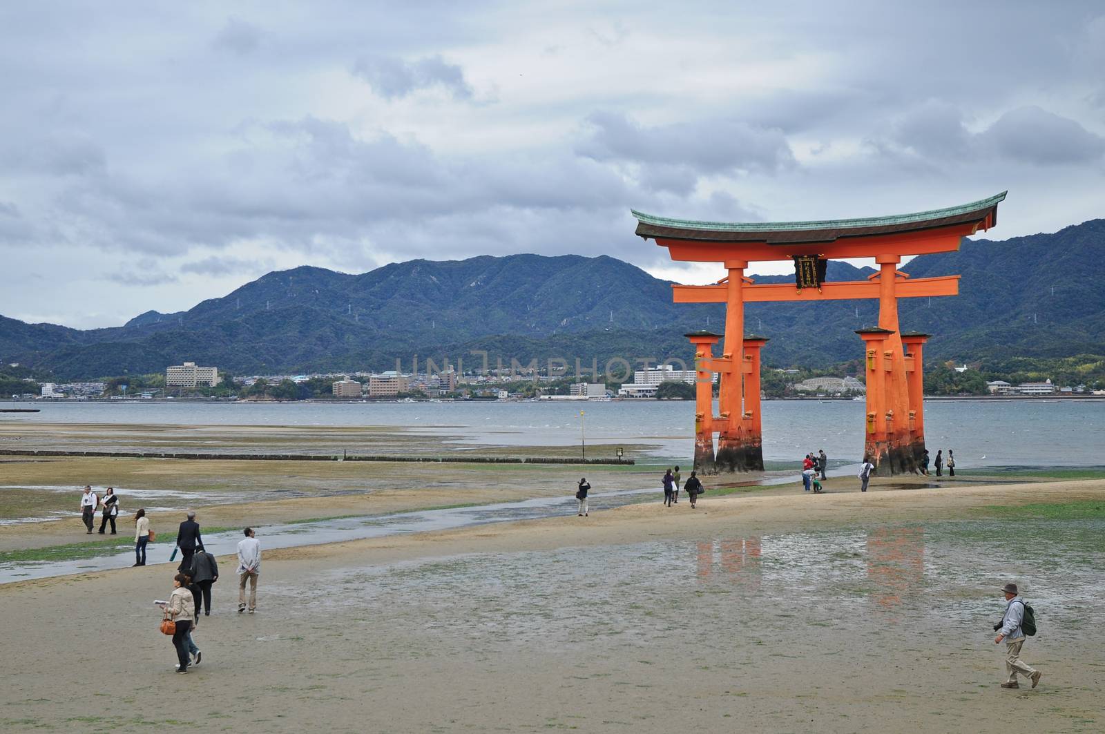 Miyajima red sacred gate on the sand in Hiroshima Japan