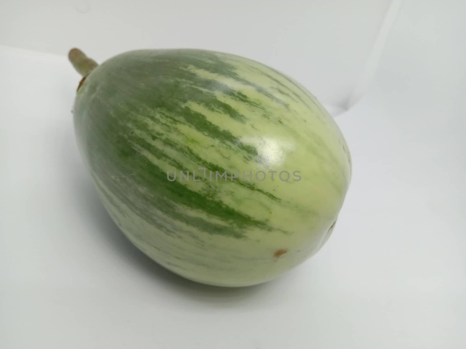 Fresh and healthy Raw Brinjal Closeup on White Background