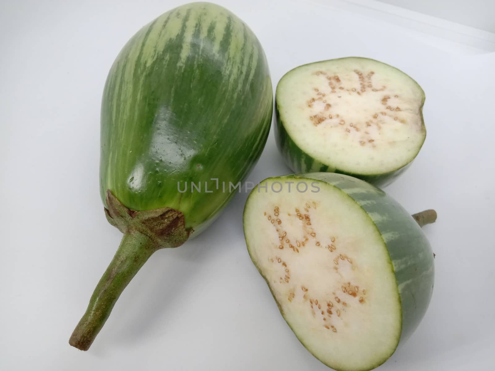 Fresh and healthy Raw Brinjal Closeup on White Background
