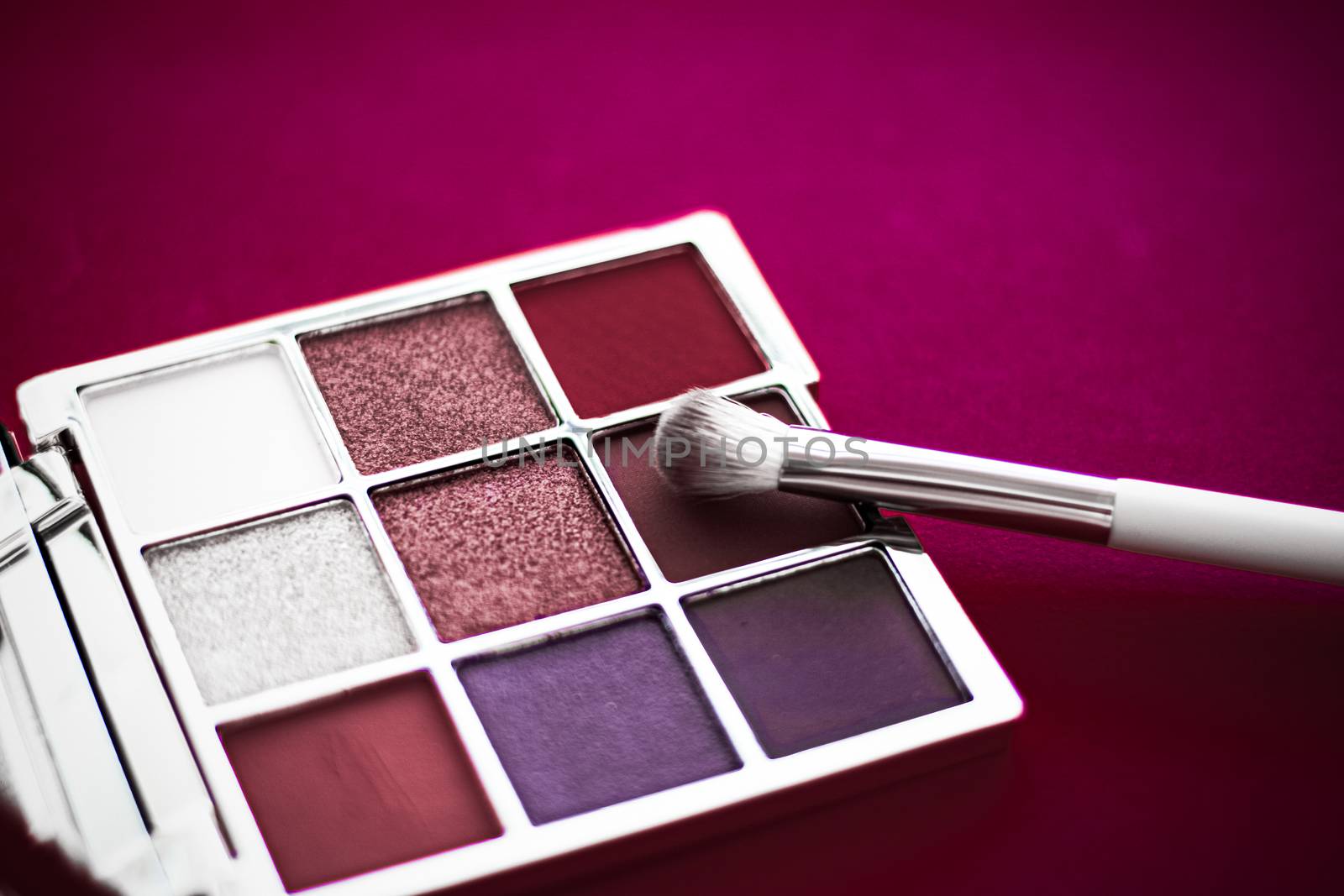 Cosmetic branding, mua and girly concept - Eyeshadow palette and make-up brush on cherry background, eye shadows cosmetics product for luxury beauty brand promotion and holiday fashion blog design