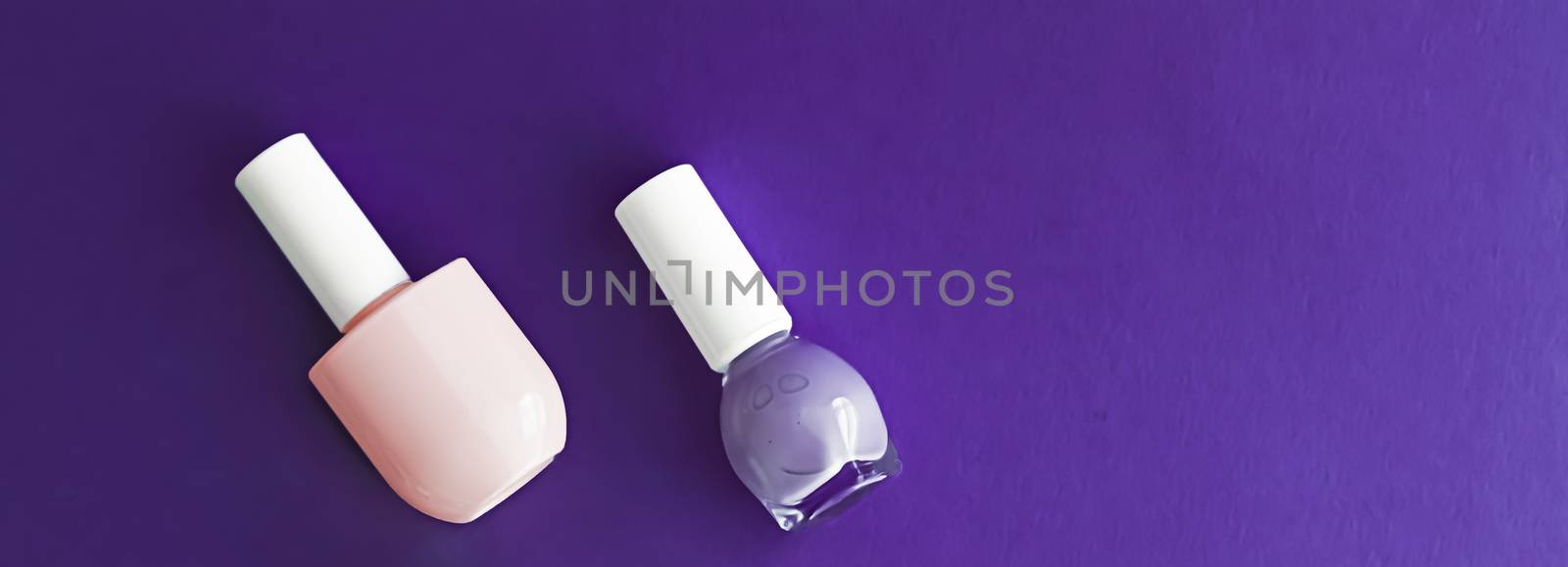 Nail polish bottles on dark purple background, beauty brand by Anneleven