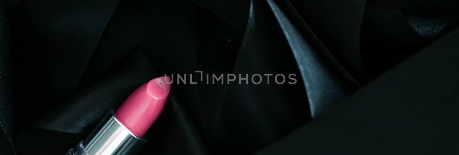 Pink lipstick on black silk background, luxury make-up and beaut by Anneleven