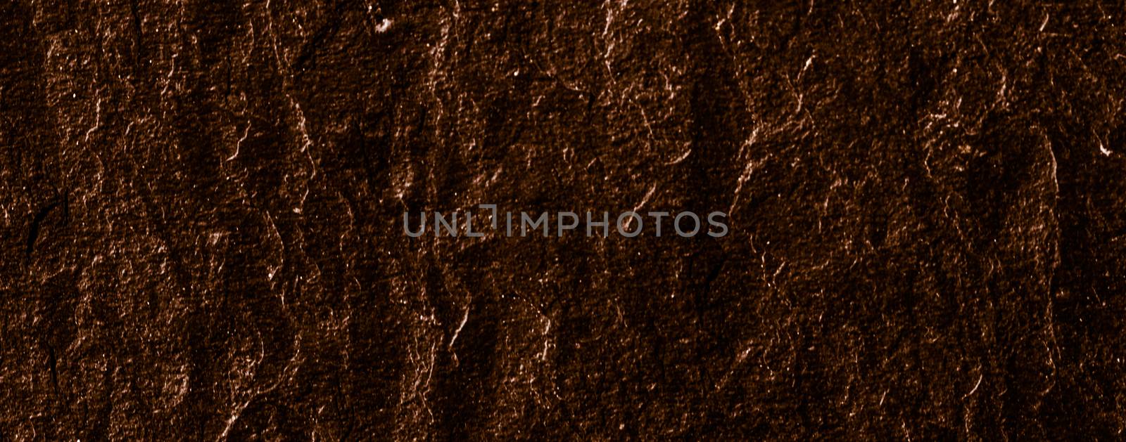 Brown stone texture as abstract background, design material and textured surfaces