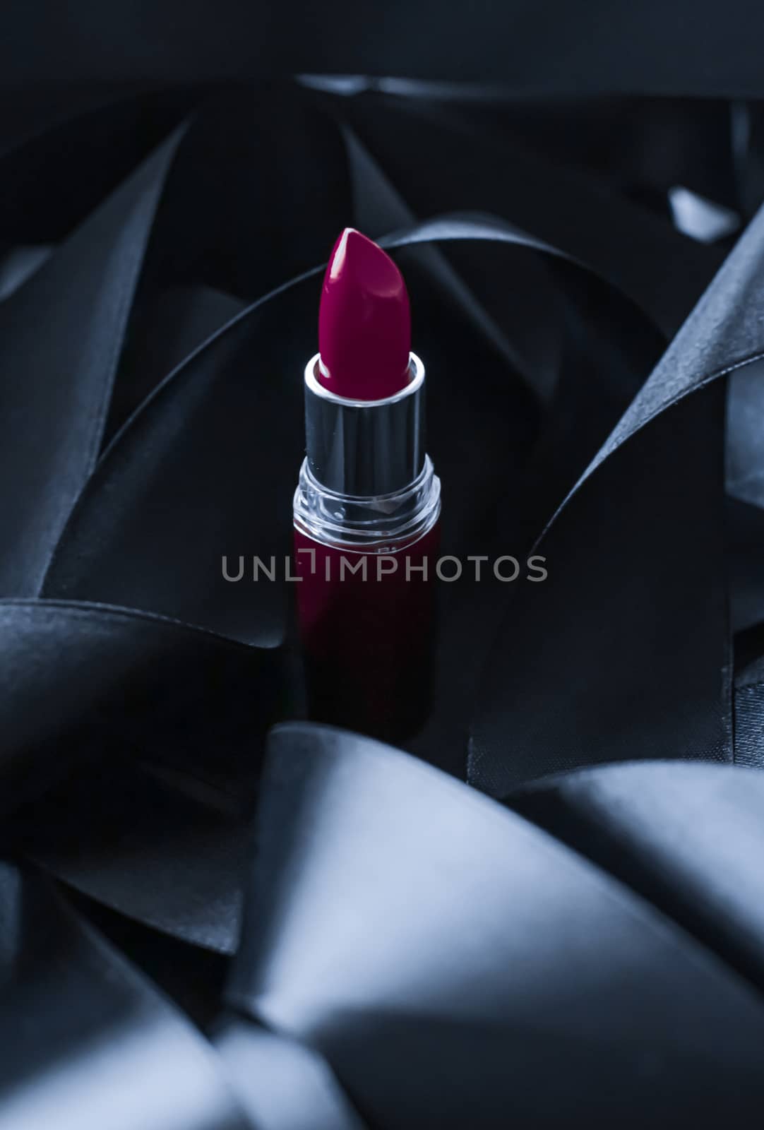 Purple lipstick on black silk background, luxury make-up and bea by Anneleven