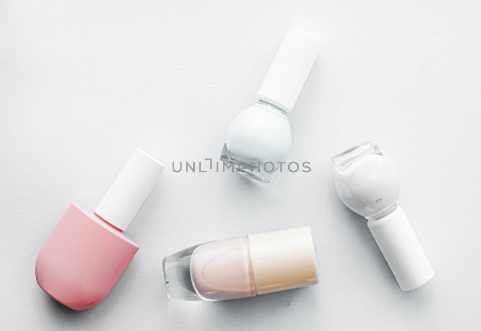 Nail polish bottles on white background, beauty brand by Anneleven