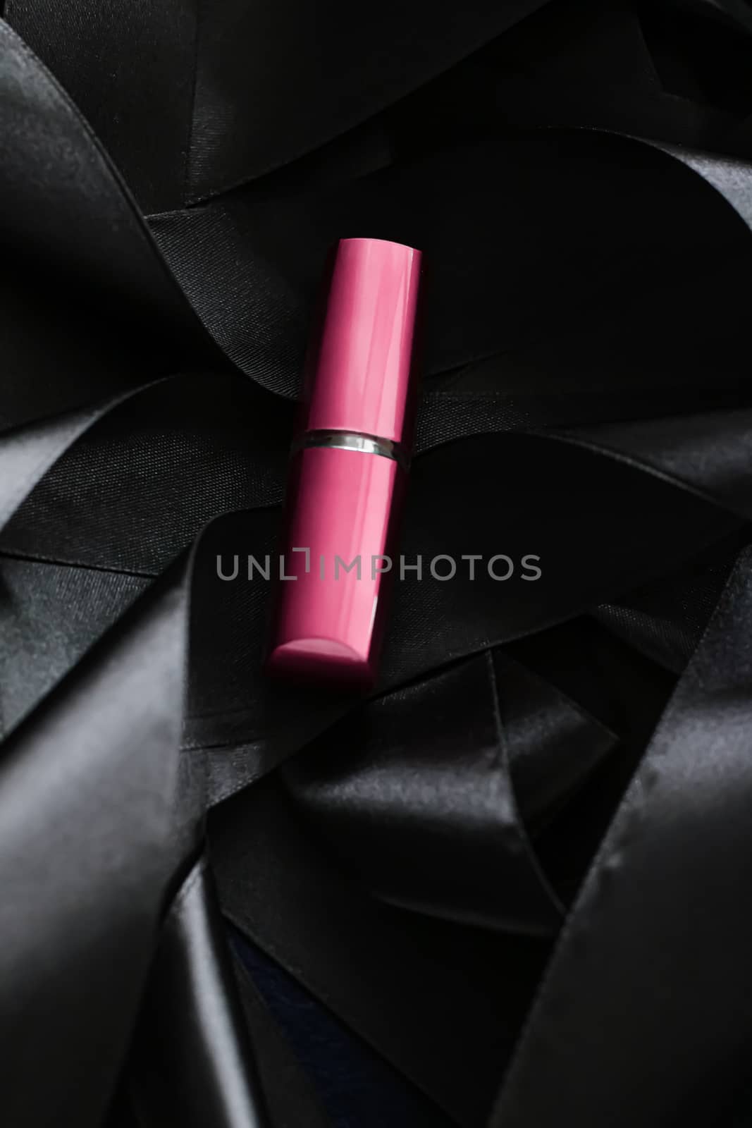 Pink lipstick on black silk background, luxury make-up and beaut by Anneleven