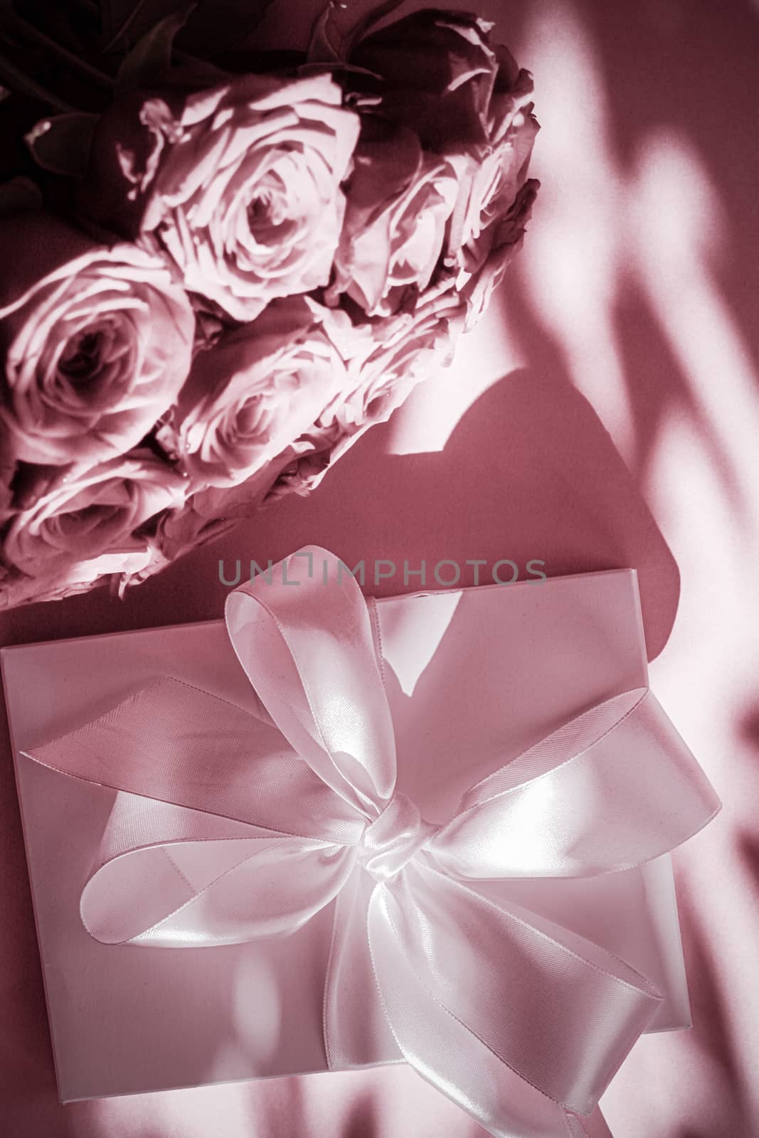 Luxury holiday silk gift box and bouquet of roses on blush pink  by Anneleven