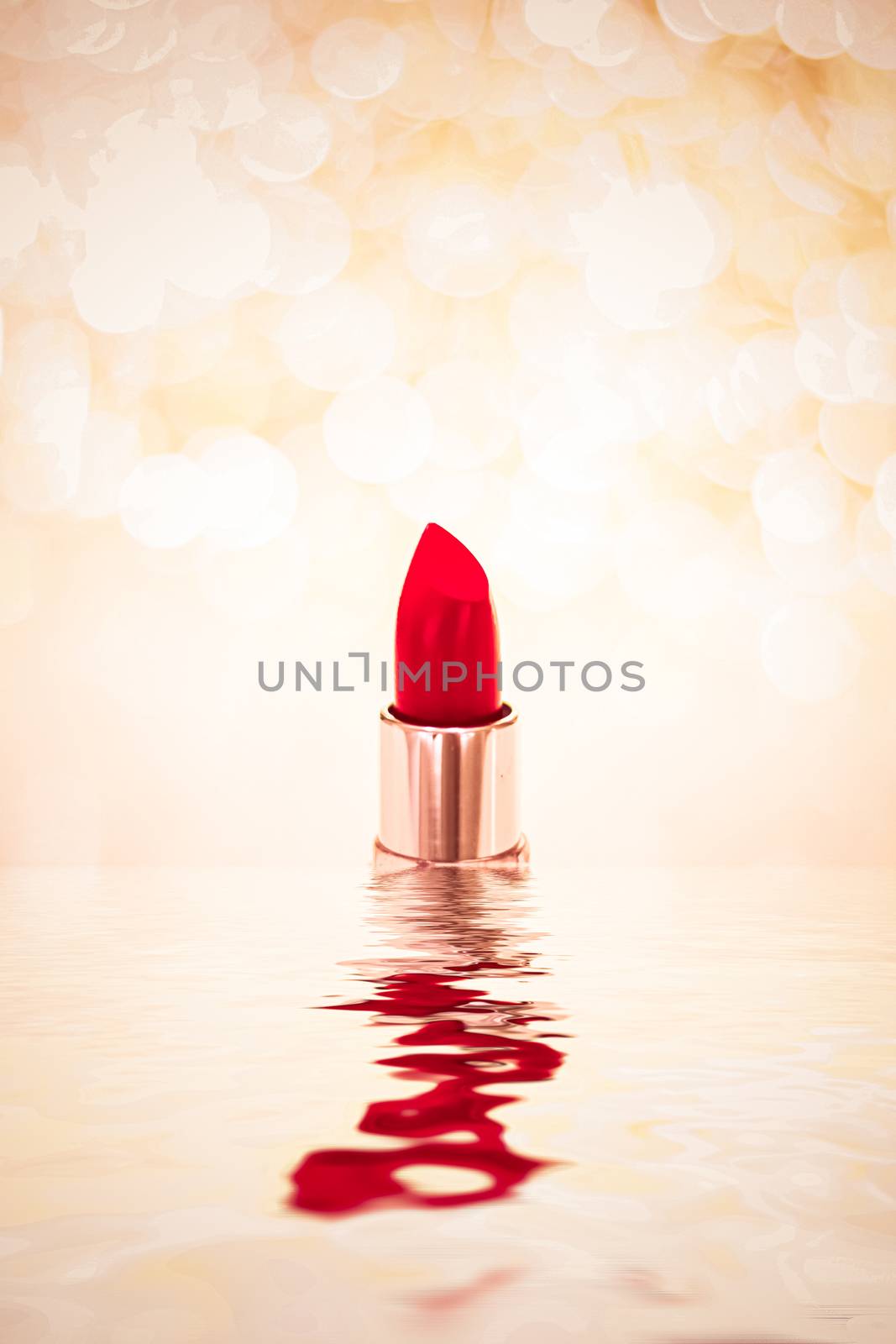 Red lipstick on golden background, make-up and cosmetic product by Anneleven