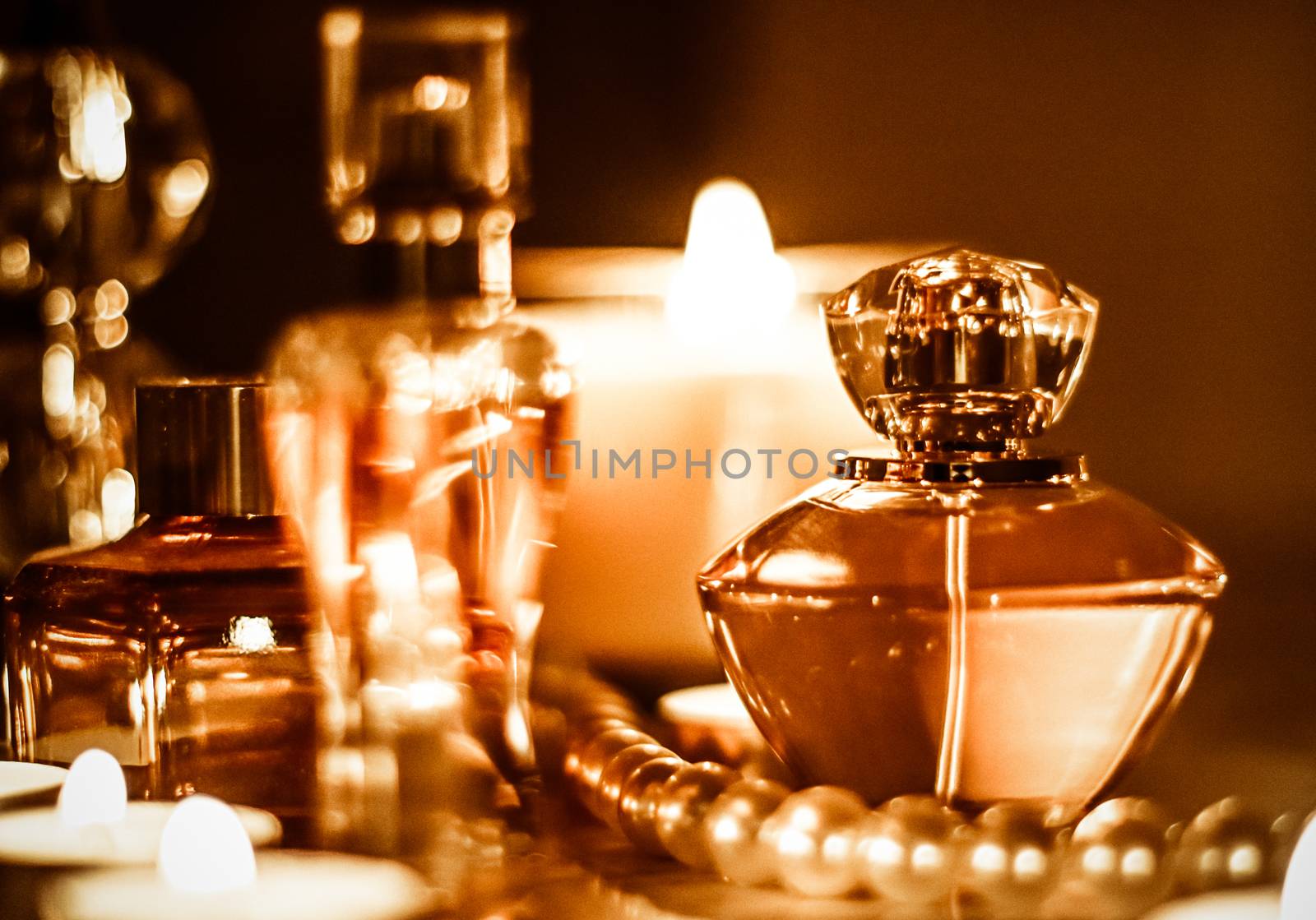 Perfume bottle and vintage fragrance on glamour vanity table at  by Anneleven