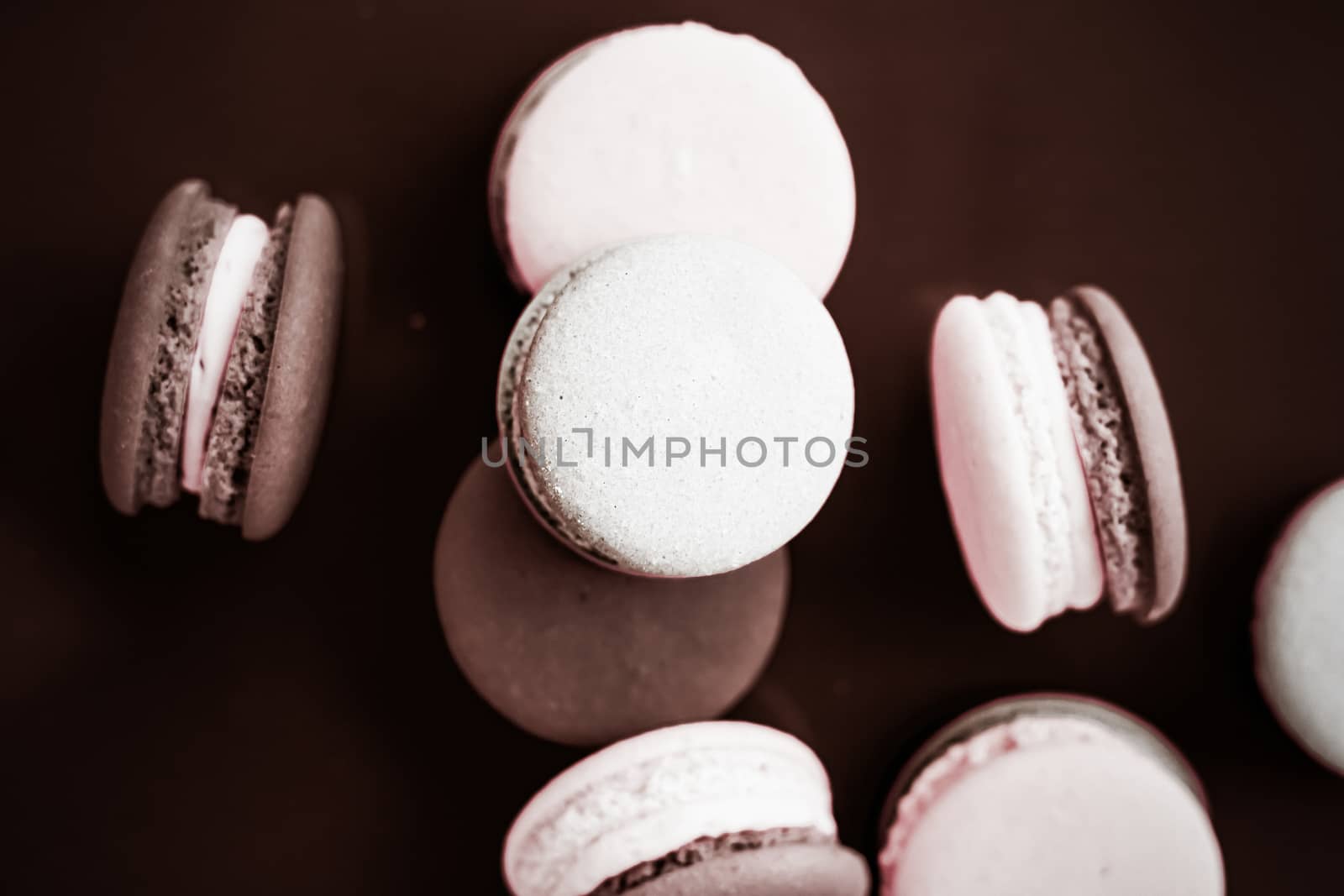 French macaroons on milk chocolate background, parisian chic caf by Anneleven