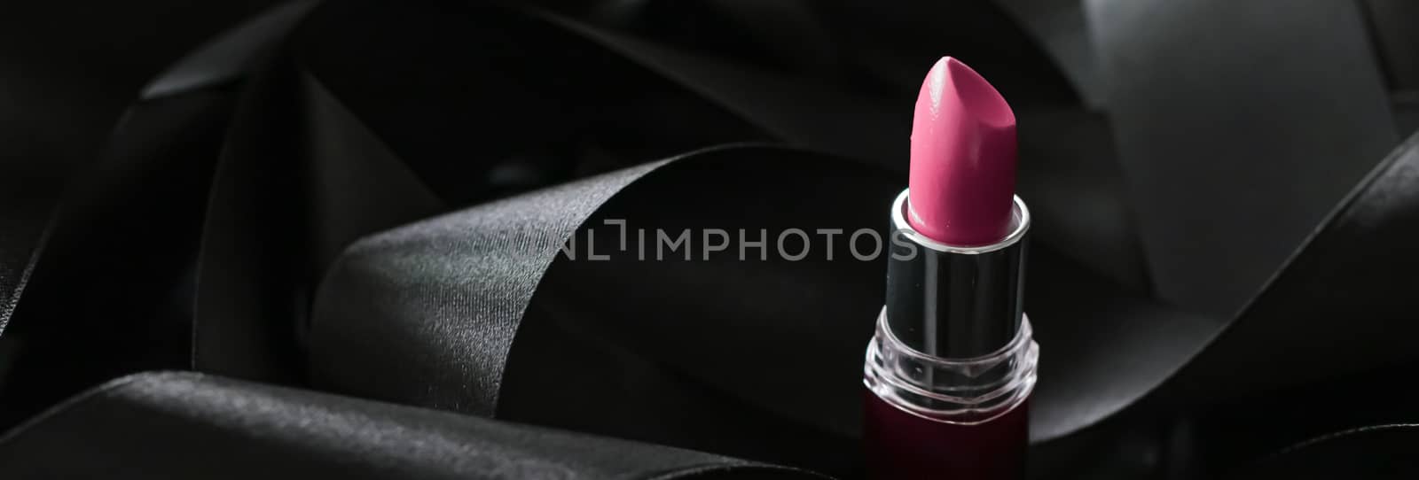 Pink lipstick on black silk background, luxury make-up and beaut by Anneleven