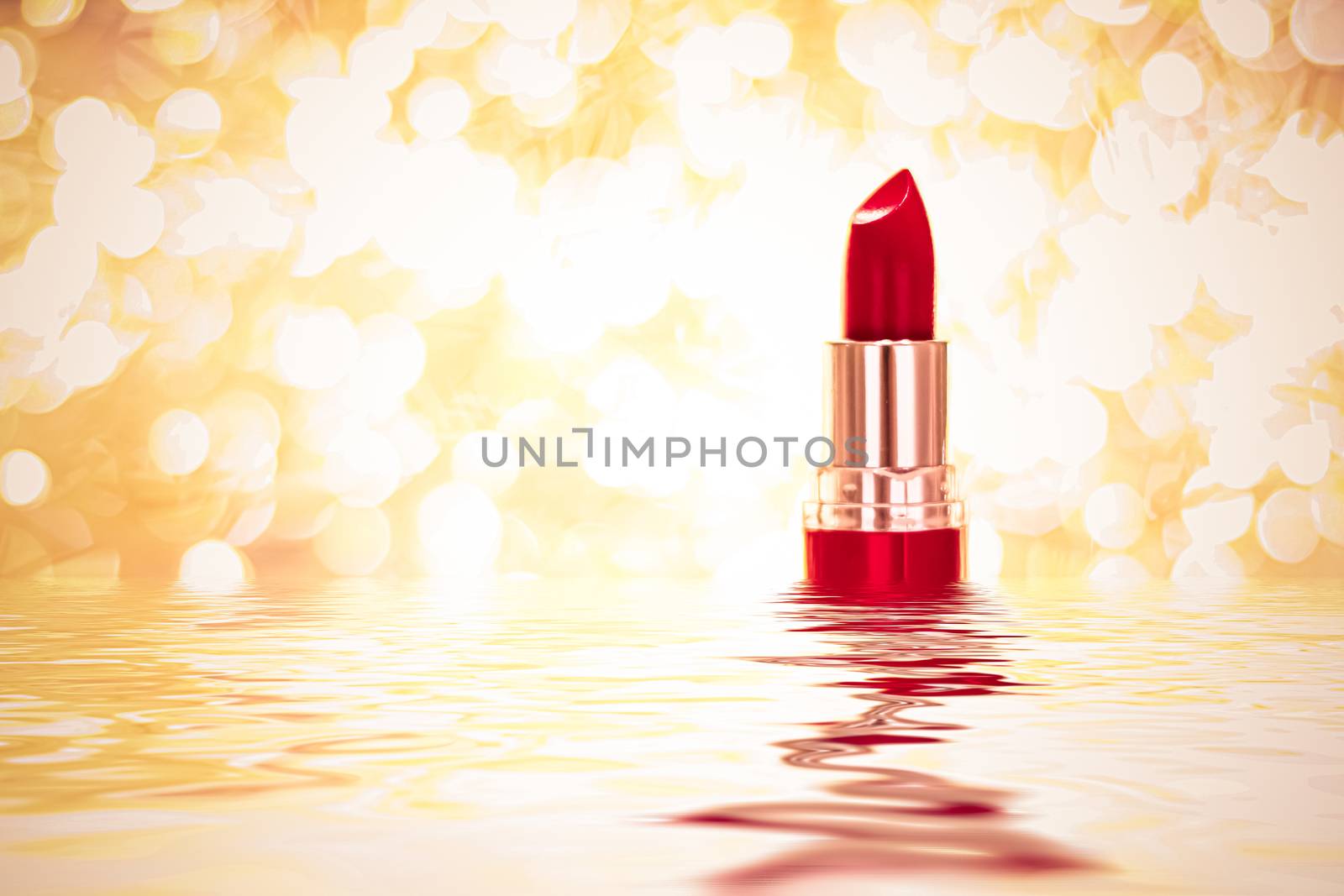 Red lipstick on golden background, make-up and cosmetics product