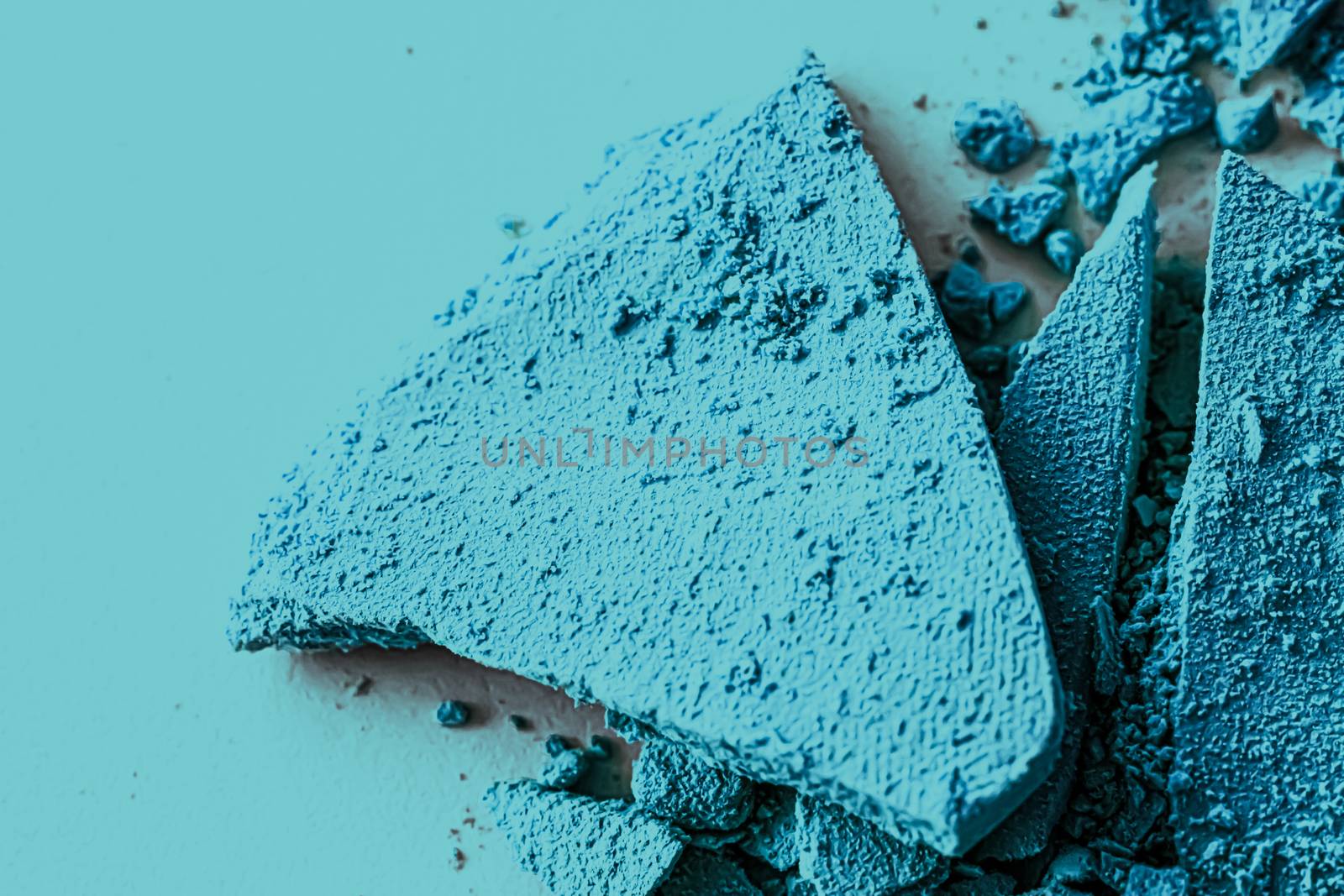 Blue eye shadow powder as makeup palette closeup, crushed cosmet by Anneleven