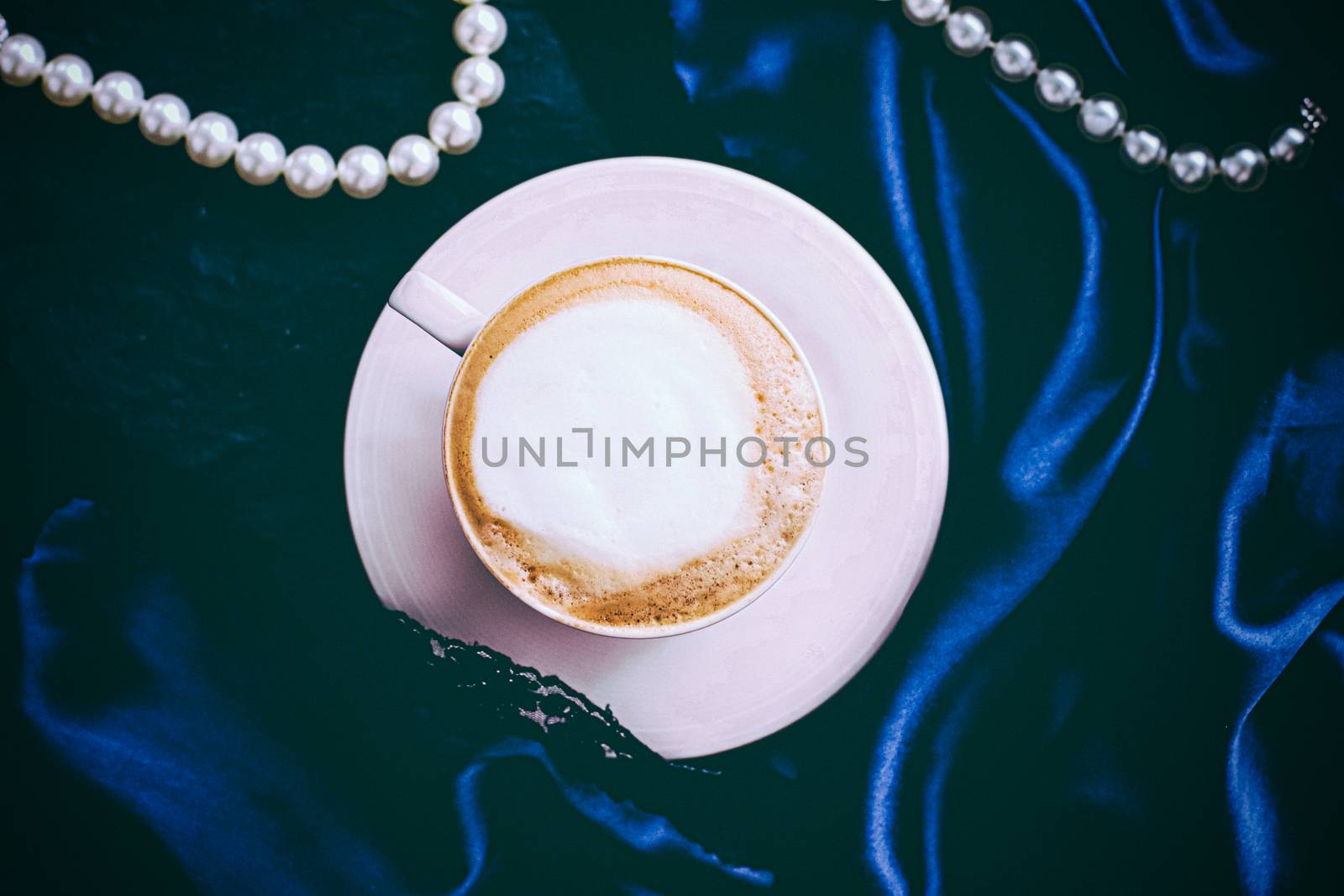 Menu, branding and recipe concept - Cup of cappuccino for breakfast with satin and pearls jewellery background, organic coffee with lactose free milk in parisian cafe for luxury vintage holiday brand