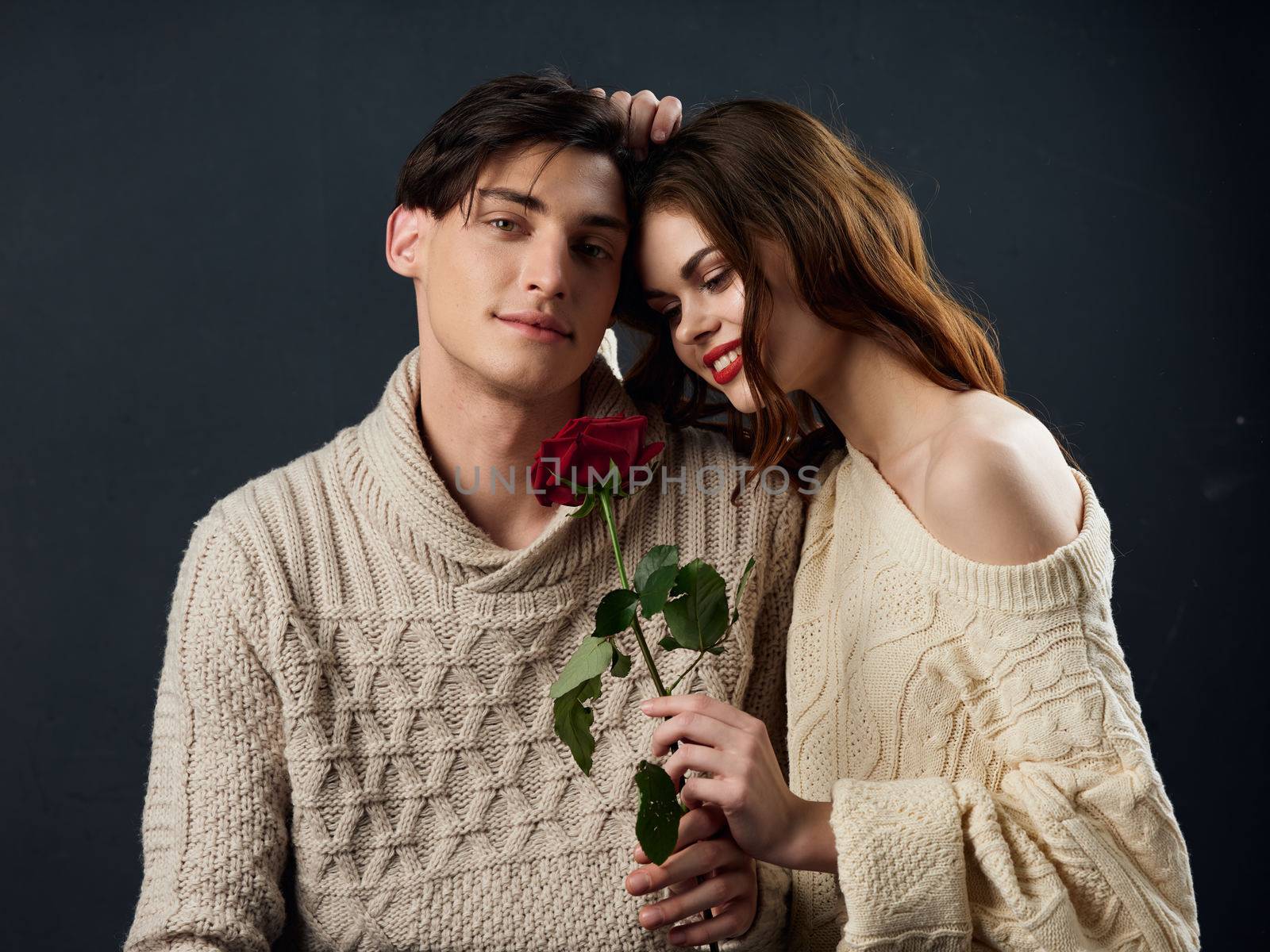Young couple of lovers rose in hands hugs romance portrait by SHOTPRIME