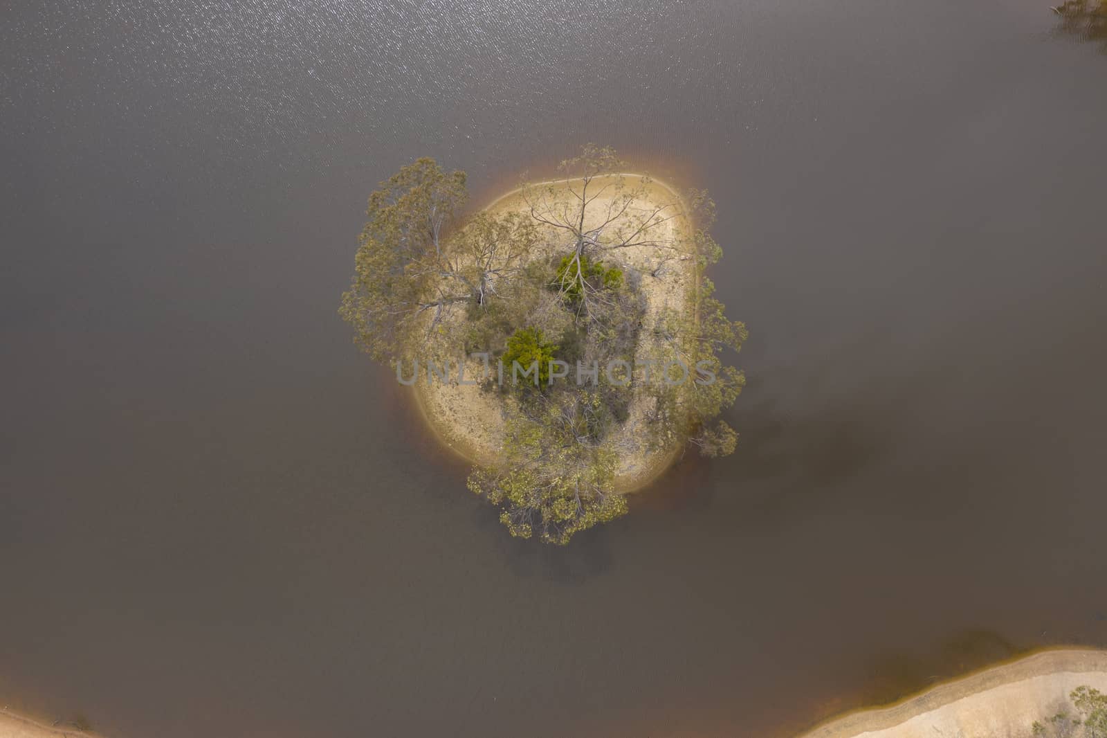 Aerial view of a drought affected water reservoir in regional Australia by WittkePhotos