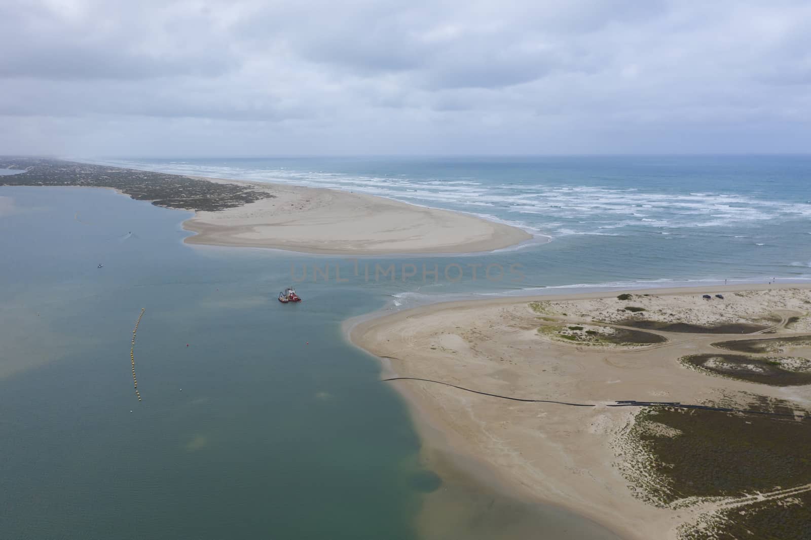 Aerial view of a sand dredger boat at the mouth of the Murray River in South Australia