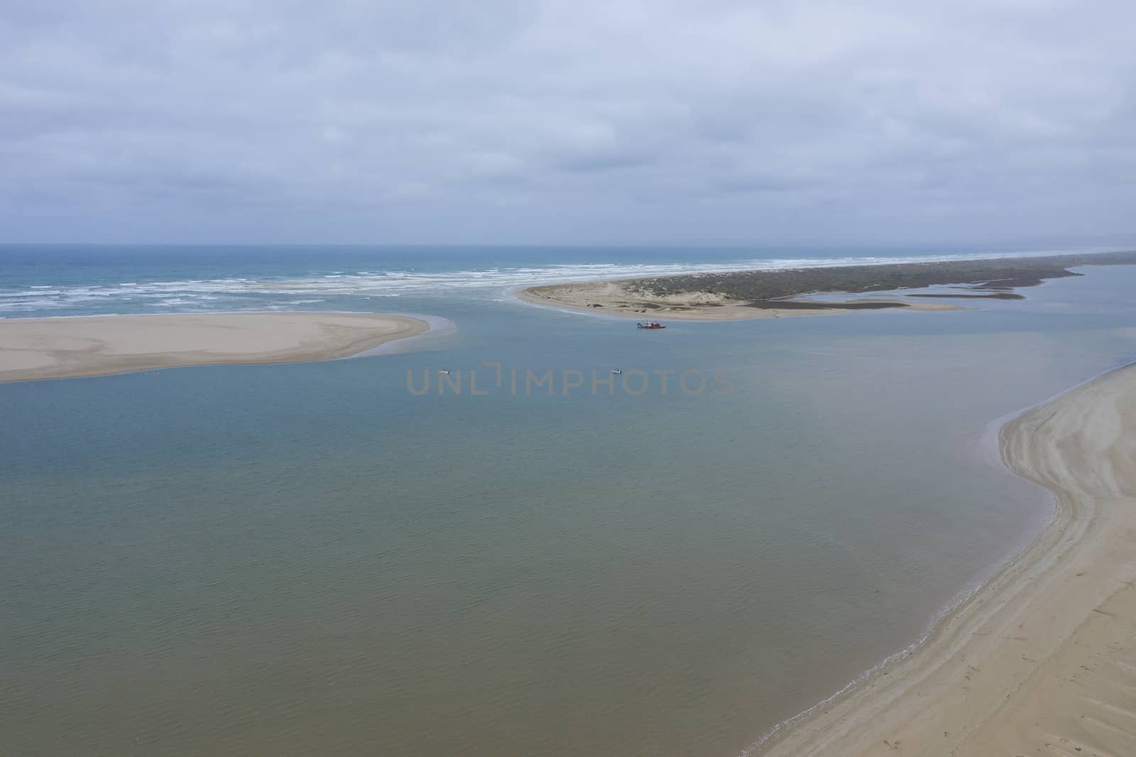 Aerial view of a sand dredger at the mouth of the River Murray in regional Australia by WittkePhotos